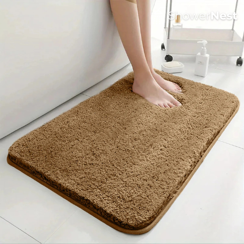 Brown thick shaggy non slip bath mat in a modern luxury bathroom by ShowerNest
