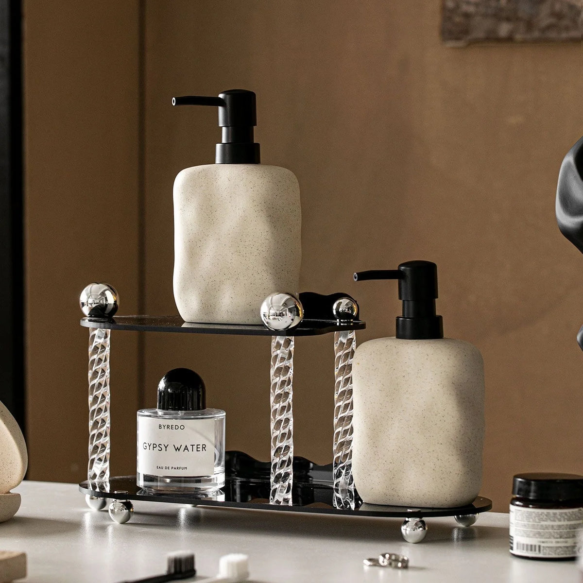 Wabi-sabi ceramic soap dispenser styled in a bathroom