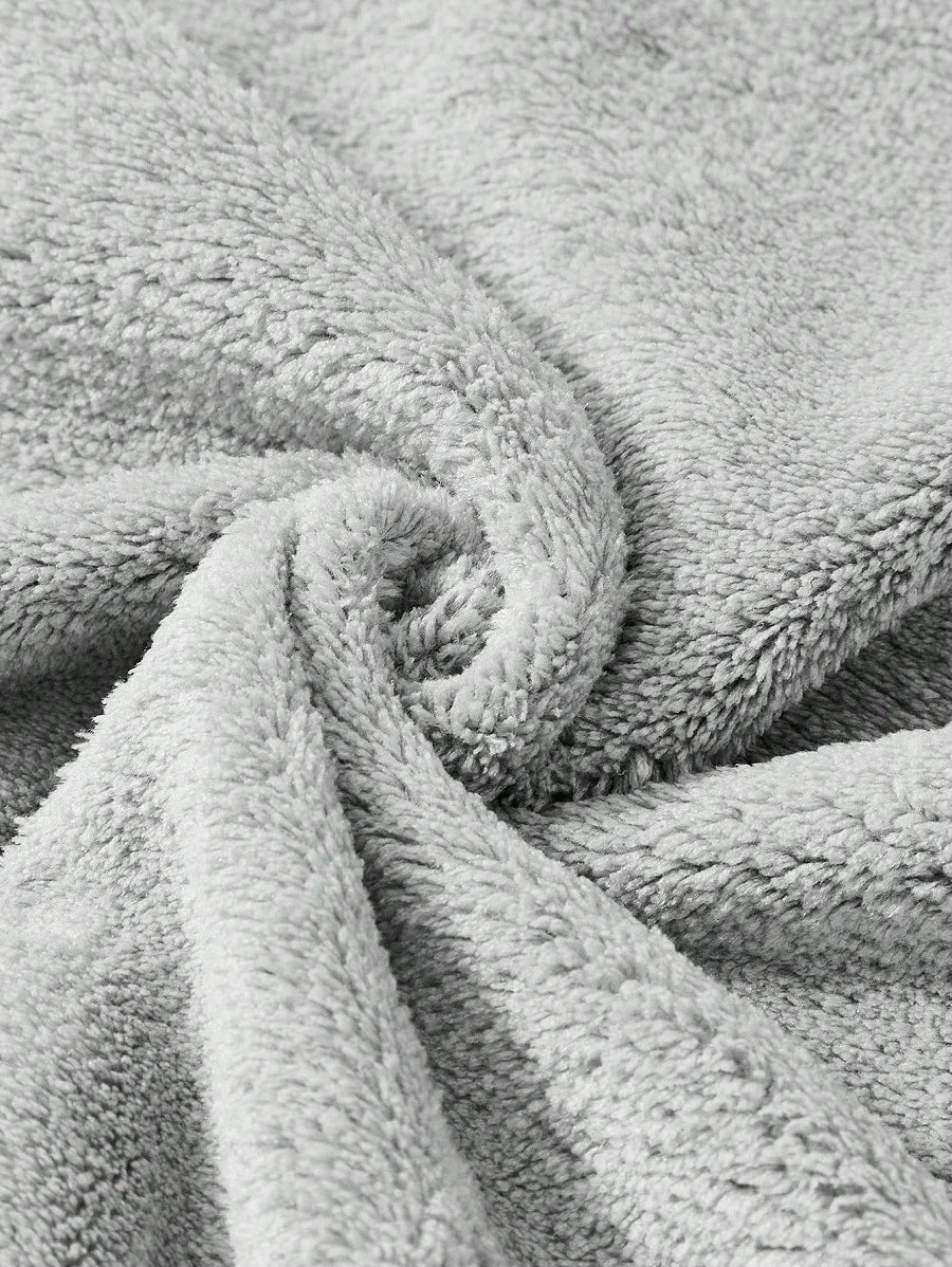 Close-up of the soft grey fabric of the koala hooded towel poncho – ShowerNest Australia