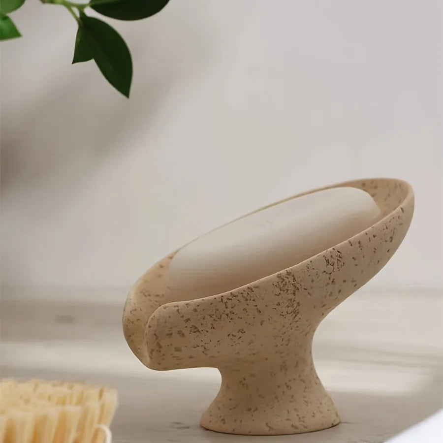 Tilted leaf soap holder letting water run off