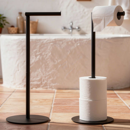 Black free standing toilet roll holder on terracotta floor tiles