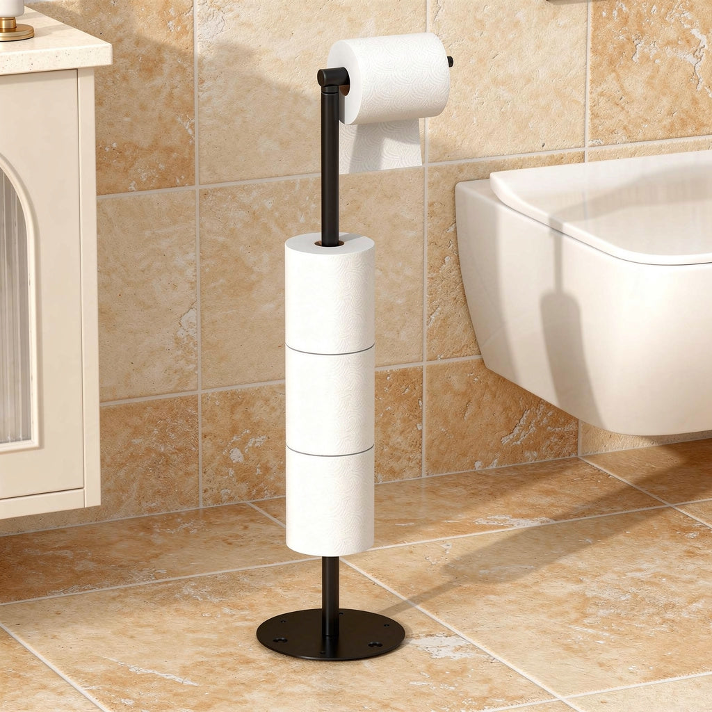 Black free-standing toilet paper stand beside a toilet